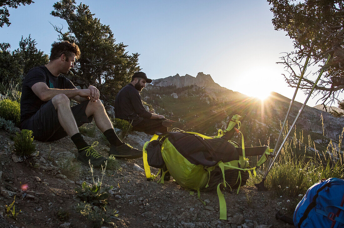 Two Hikers Takes A Break While Hiking Towards Utah's Lone Peak Located In The Wasatch Mountains