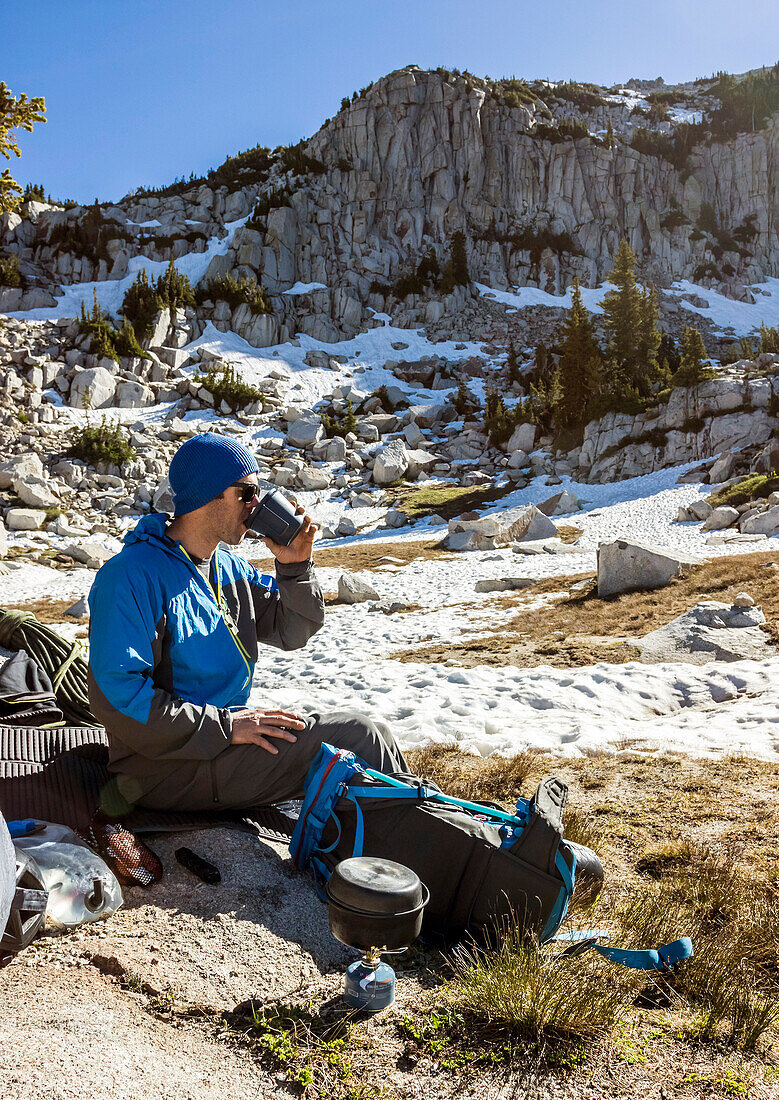 A Man Cooks Breakfast And Enjoys His Coffee While Camping In The Lone Peak Wilderness In Utah's Wasatch Mountains