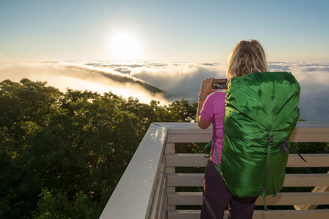 A Woman Enjoy Taking Picture During A Foggy Morning At The Green Knob Firetower, Celo, North Carolina