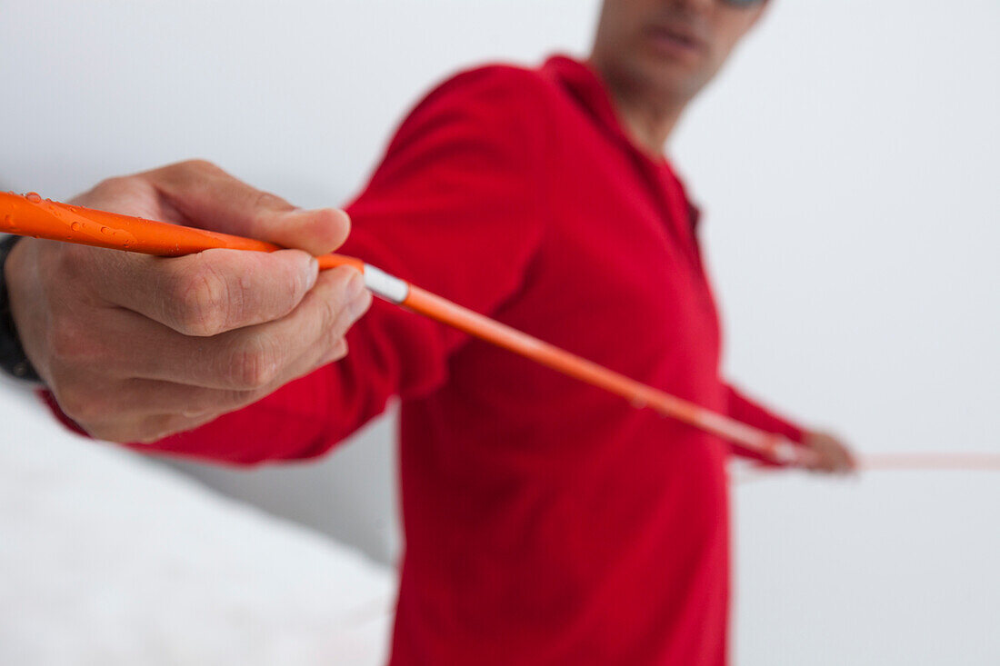 Close-up Of A Camper Snapping His Tent Pole Together.