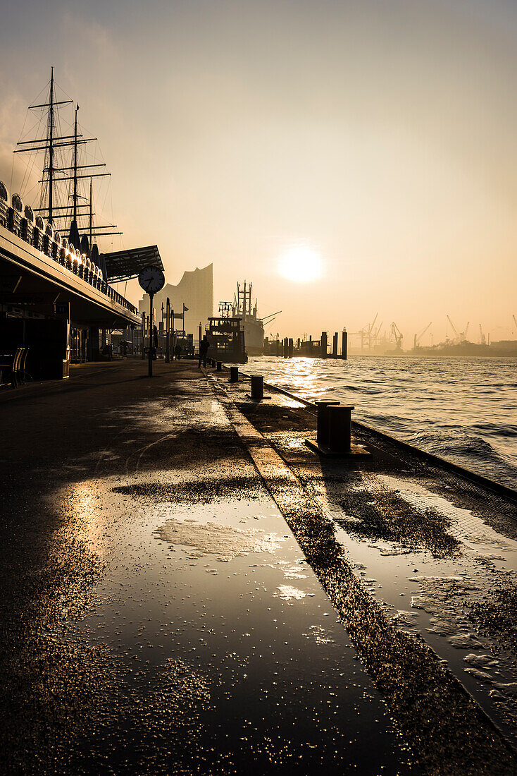 Sunrise at Hamburg port at the famous landing pier and the Elbphilharmonie, Hamburg, Germany