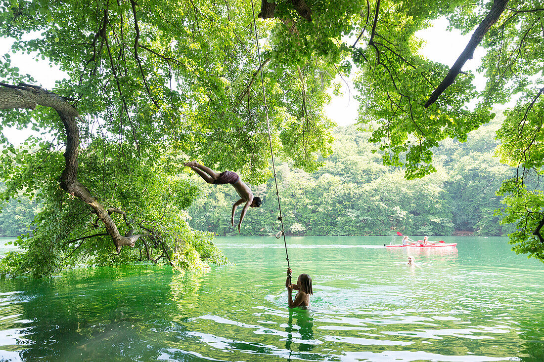 canoe tour, water jumping from a tree, holiday, summer, swimming, small Luzin, Feldberg, Mecklenburg lakes, Mecklenburg lake district, Mecklenburg-West Pomerania, Germany, Europe
