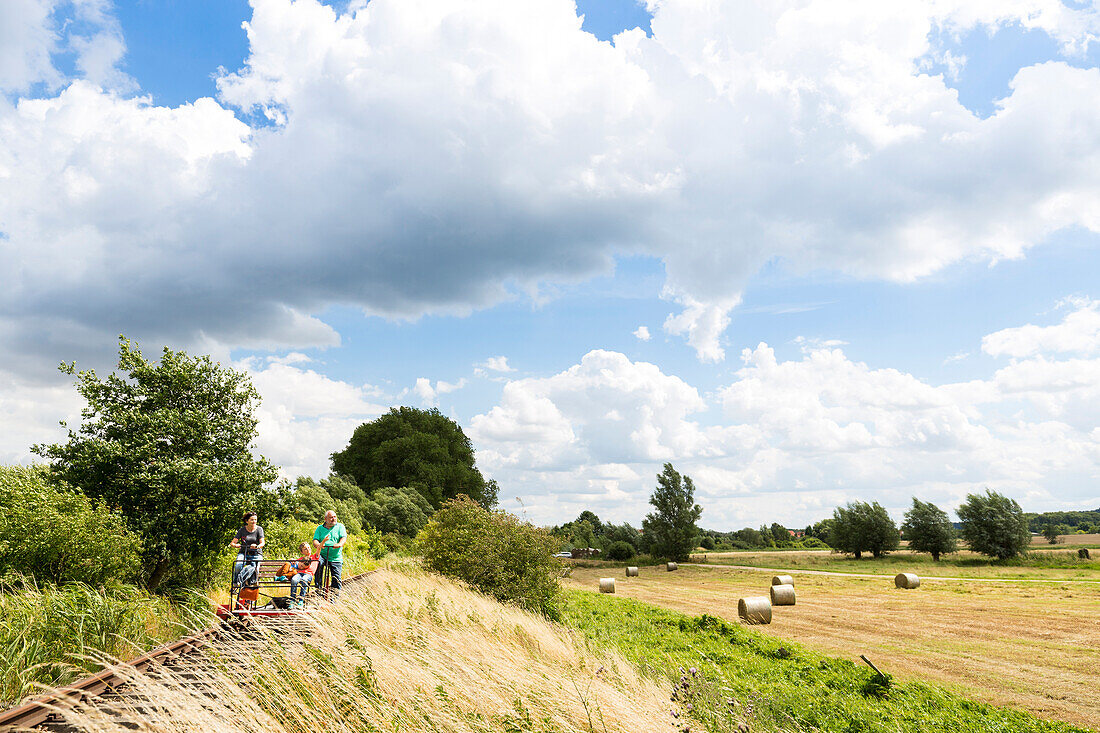 Grandparents with their grandchildren, handcar drive from Dargun to lake Kummerow, landscape, summer, Mecklenburg lakes, Mecklenburg lake district, near Dargun, Mecklenburg-West Pomerania, Germany, Europe