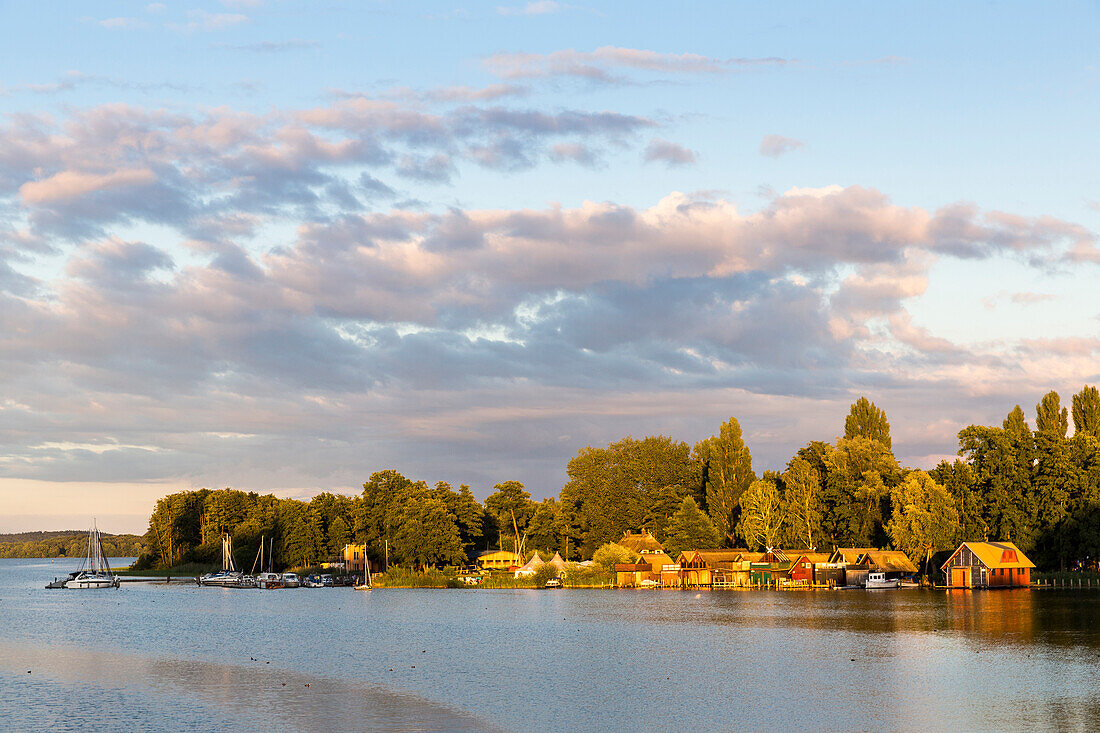 Boat houses at lakeshore, sunset, Schwerin inner lake, provincial capital, Mecklenburg lakes, Schwerin, Mecklenburg-West Pomerania, Germany, Europe