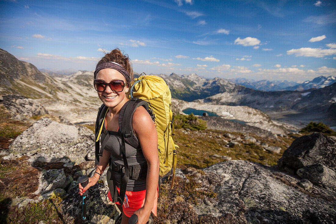 Smiling Young Woman With Backpack Hiking In Mount Marriott