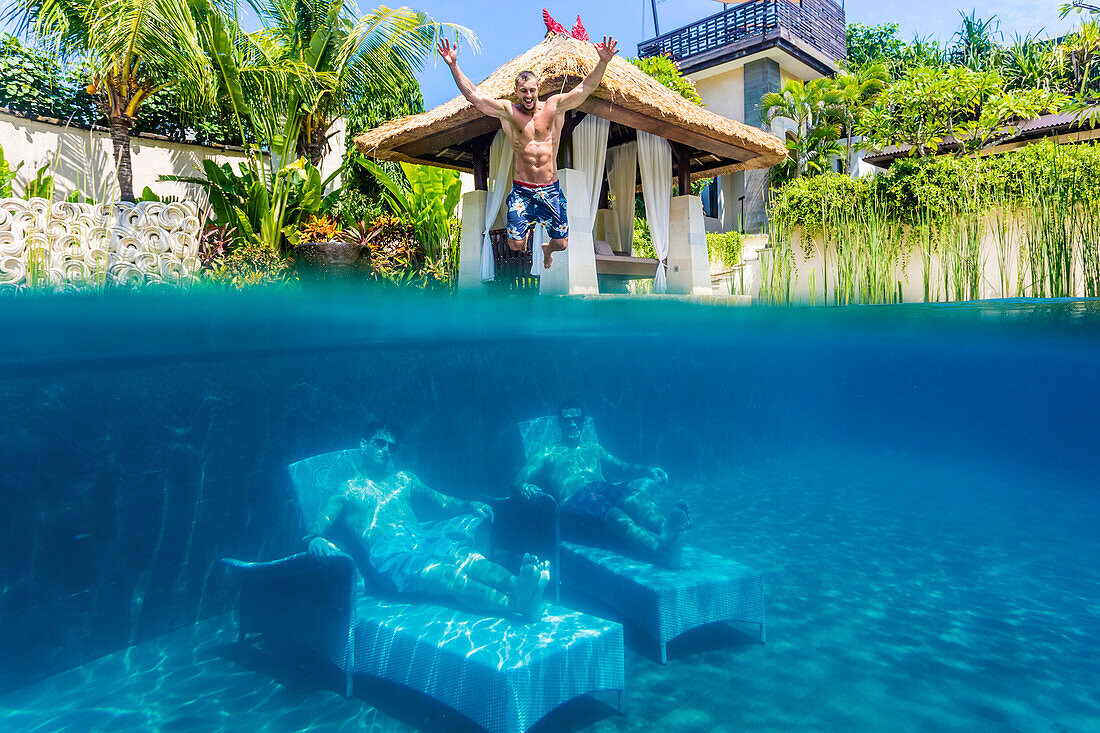 Two Men Underwater On Bed With Man Jumping In Pool From Above