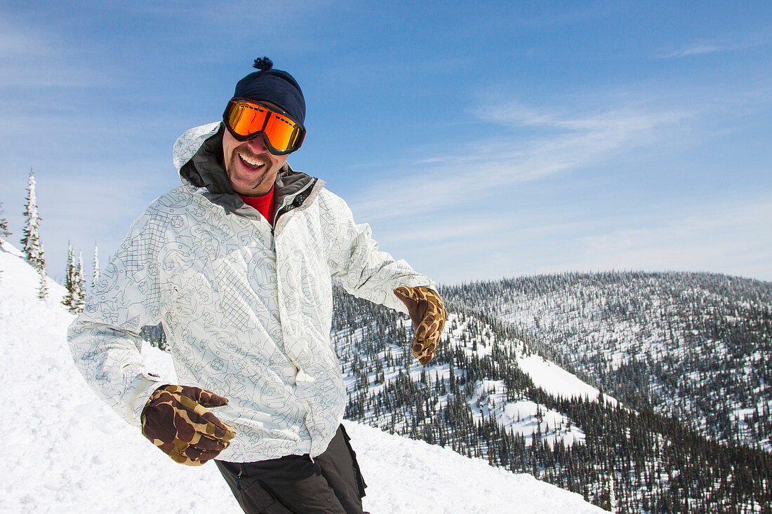 Smiling Male Snowboarder Enjoying In Whitefish, Montana, Usa