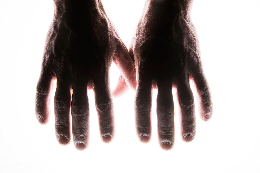 Close-up Of Strong Hands On White Background