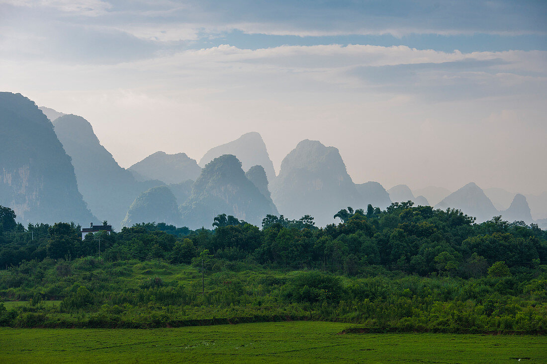 Karst Mountains Behind The Greenery Landscape In Guangxi Zhuang Autonomous Region