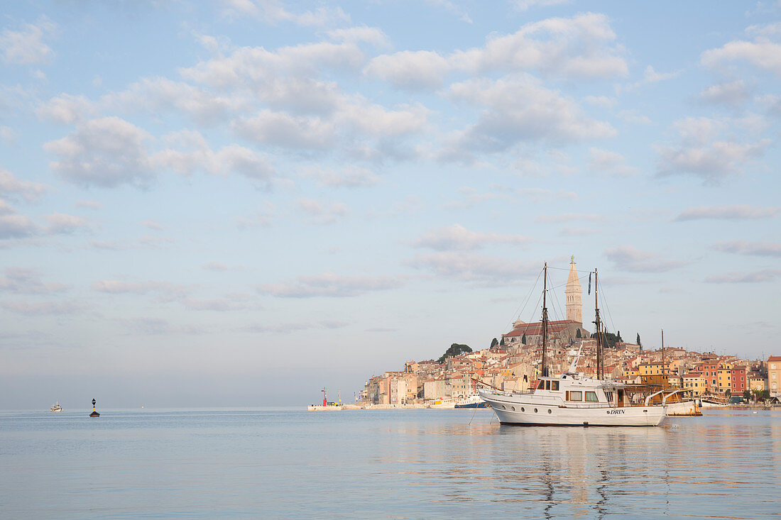 View across harbour to old town of Rovinj at sunset
