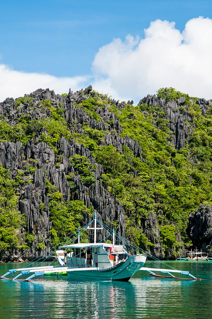 Boat Touring The Tropical Islands Of El Nido In The Philippines