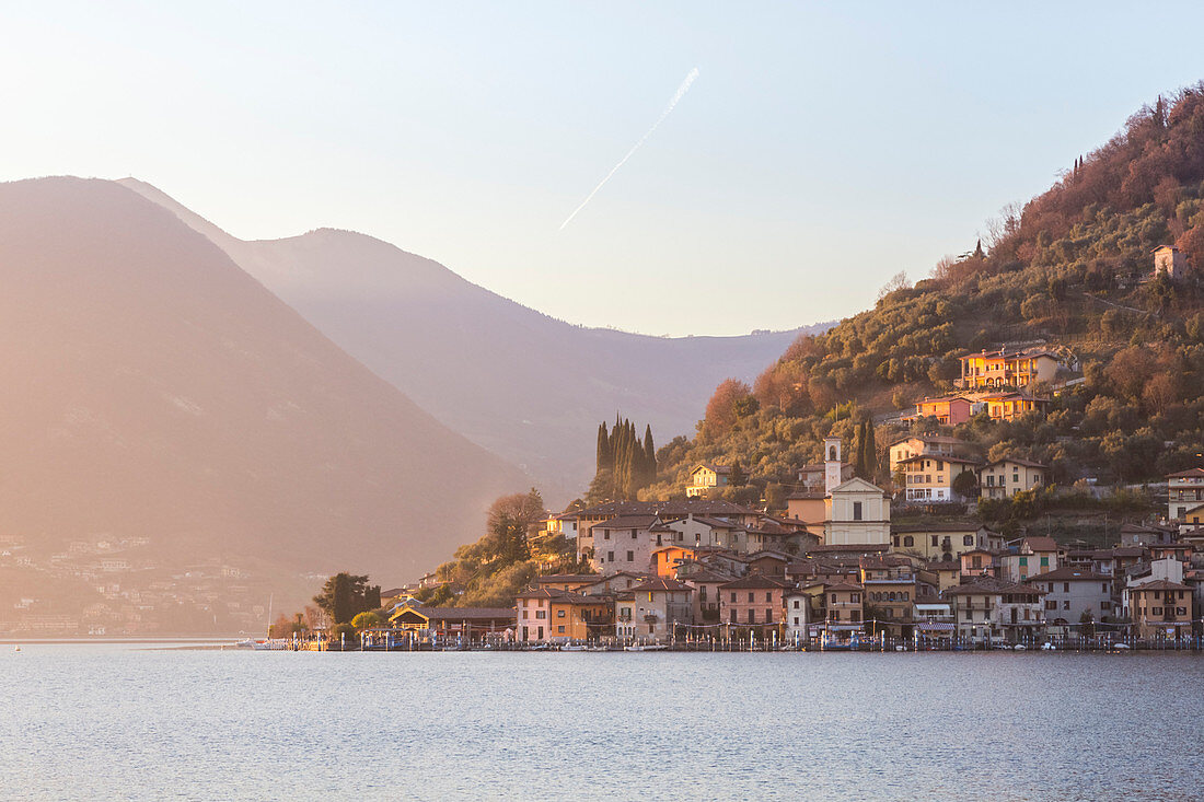 The town of Peschiera Maraglio during a winter sunset, Brescia Province, Iseo Lake, Lombardy, Italy