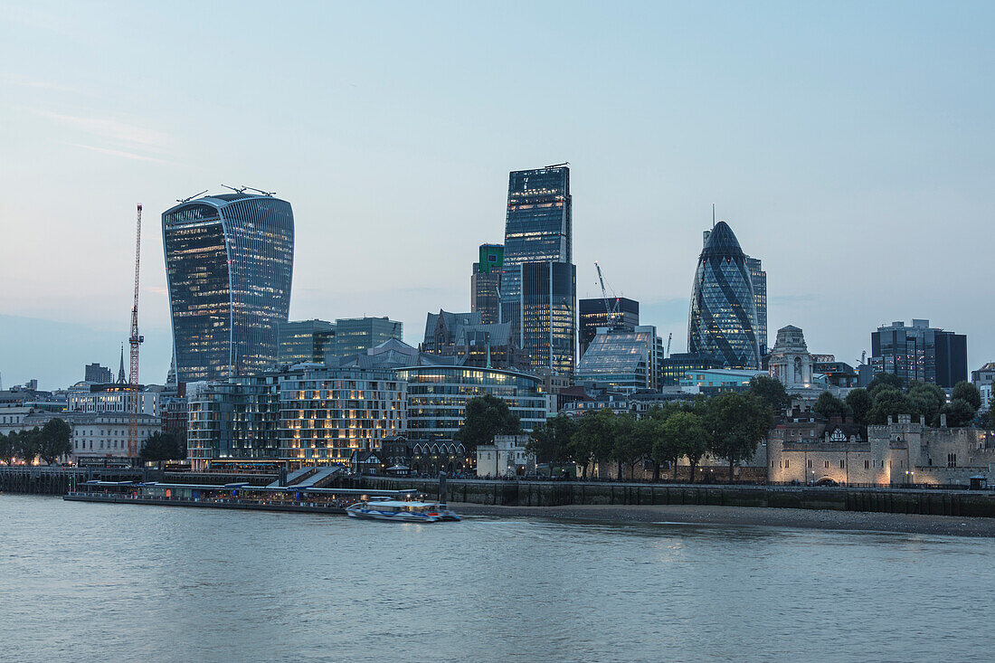 Night view of river Thames with the skyscrapers of the city in the background London United Kingdom