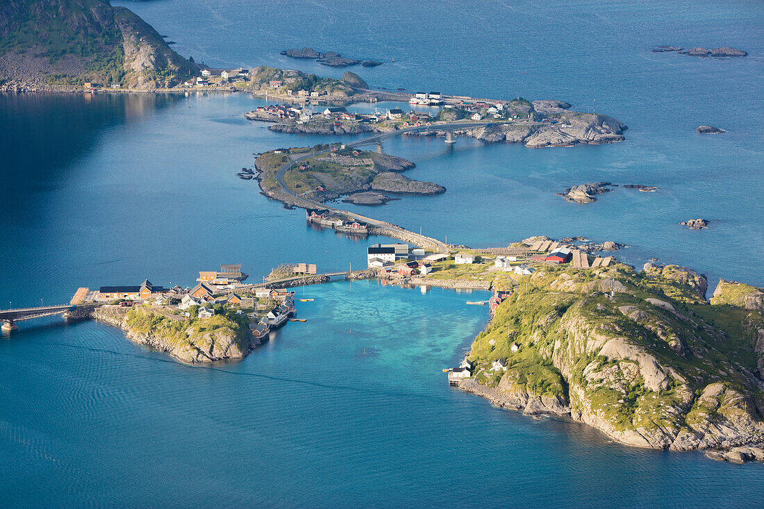 Top view of the typical houses connected by bridges framed by the blue sea Reinebringen Moskenes Lofoten Islands Norway Europe