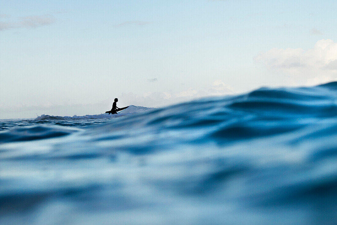 Silhouette Of A Surfer Getting Ready To Ride The Waves At North Shore Of Oahu, Hawaii