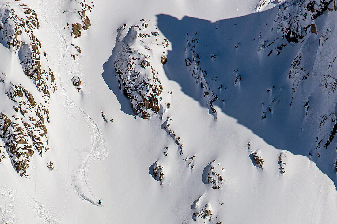 A Man Skiing At A Big Mountain Line And Gets Fresh Tracks After Ski Touring At A Backcountry Area Surrounding Cerro Catedral In Argentina