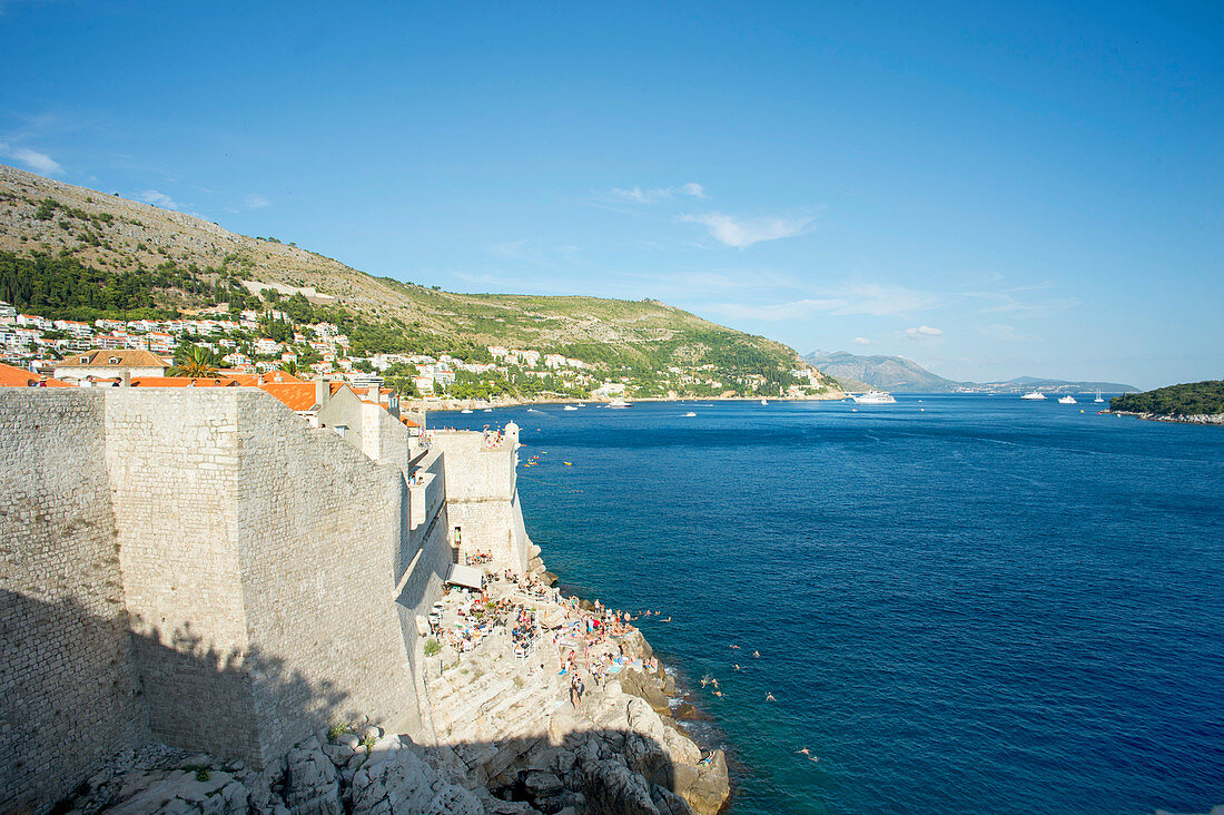 Tourists At City Wall Of Dubrovnik In The Adriatic Sea, Croatia, Europe