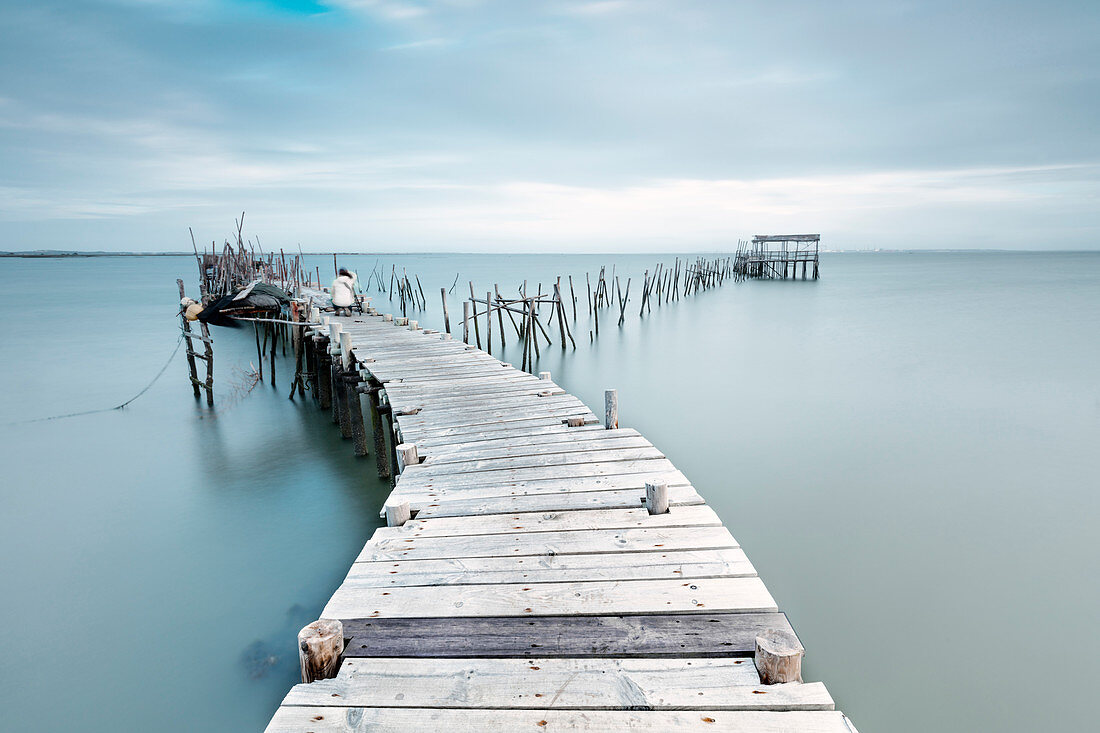 Soft light of dawn on the Palafito Pier, Carrasqueira Natural Reserve of Sado River, Alcacer do Sal, Setubal, Portugal, Europe