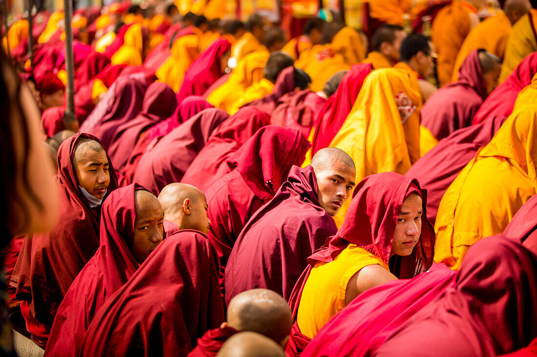 Buddhist Monks praying around temple at Bouddha (Bodhnath), Kathmandu, Nepal, Asia