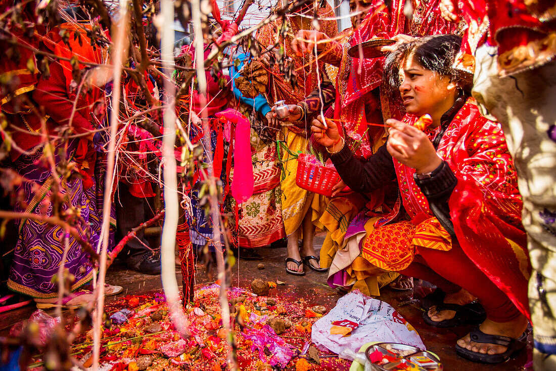 Woman praying at the Holi Festival, Durbar Square, Kathmandu, Nepal, Asia