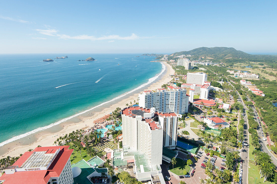 An aerial view of the sunny coast of the touristic beach city of Ixtapa, in Zihuatanejo, Guerrero, Mexico.