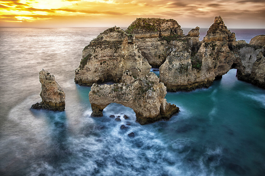 Ponta da Piedade sea stacks and arches captured at sunrise, Portugal.