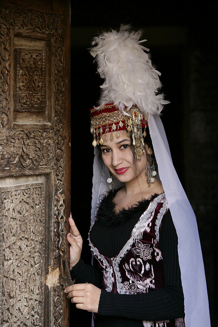 Traditionally Dressed Uzbek Woman Performer at the Toshhovli Palace in Khiva Uzbekistan