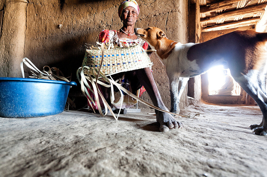 Senegalese woman inside her adobe house in the village of Dilapao, Casamance, Senegal