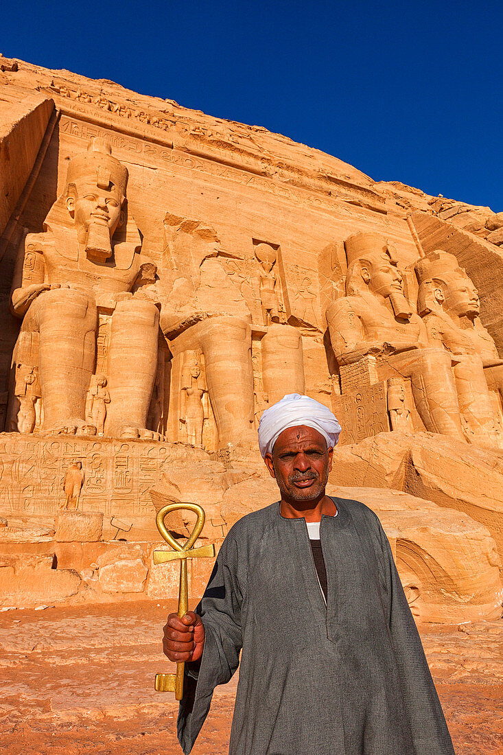 Portrait Of Man Holding Huge Golden Key Outside Temple