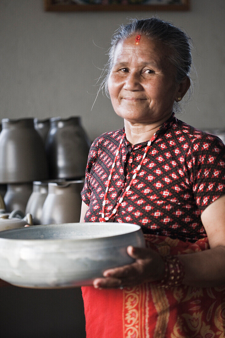 Portrait of Smiling woman At Thimi Ceramics in Nepal