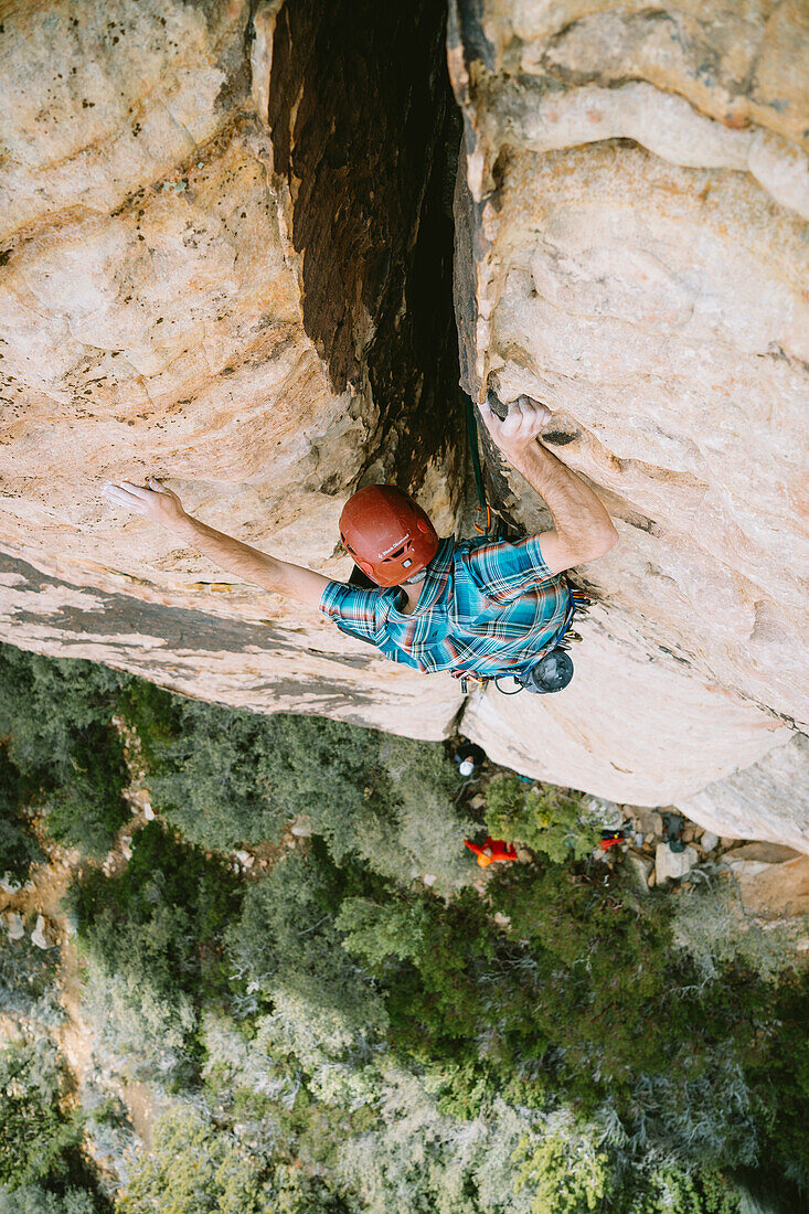 'A climber leading ''Revoked'' (5.5) in Red Rock Canyon, Nevada'