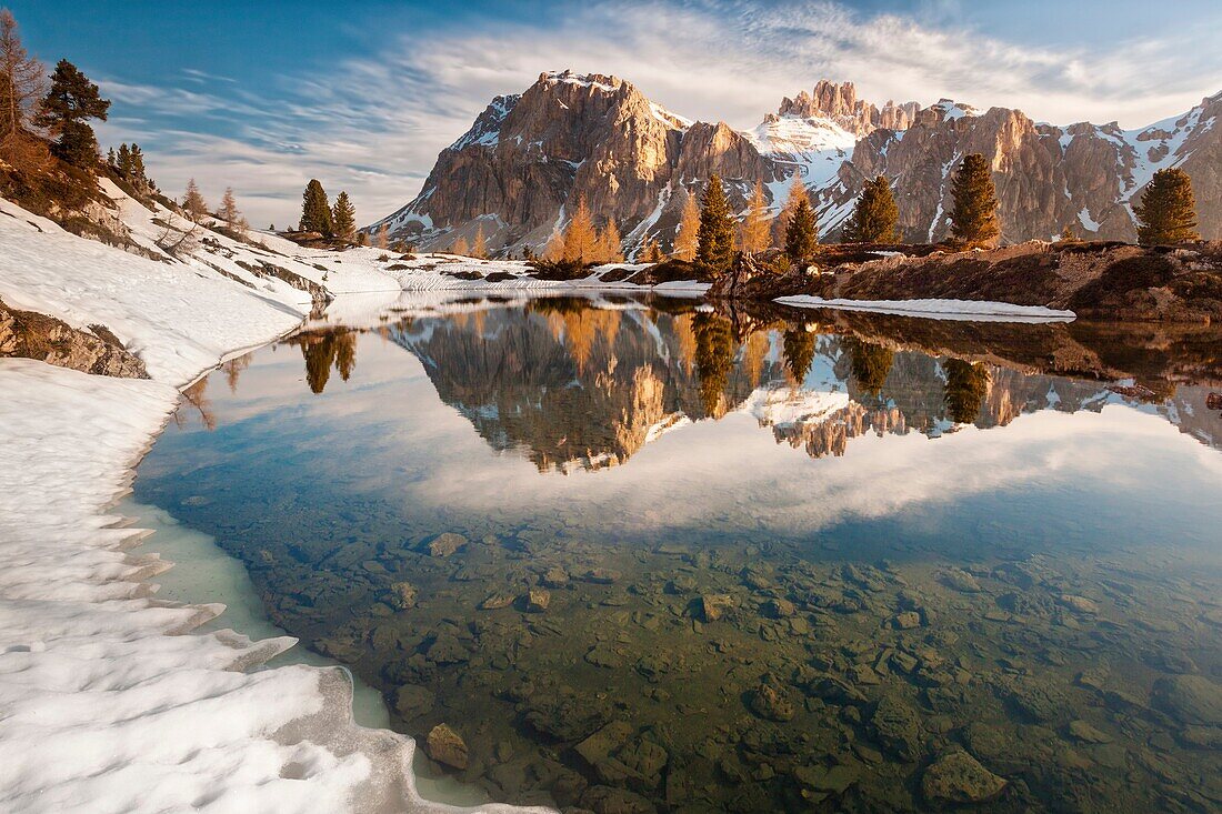 The alpine lake Limedes in a spring morning with the mounts Lagazuoi and Fanis reflcted, Dolomites, Belluno, Italy