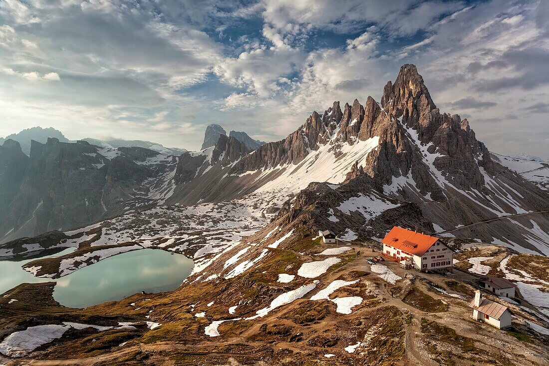 The refuge ANTONIO Locatelli - S Innerkofler - DREIZINNENHÜTTE and Mount Paterno In the valley below the beautiful lakes of Piani (Bödenseen), in a dawn of early summer Dolomites, Italy