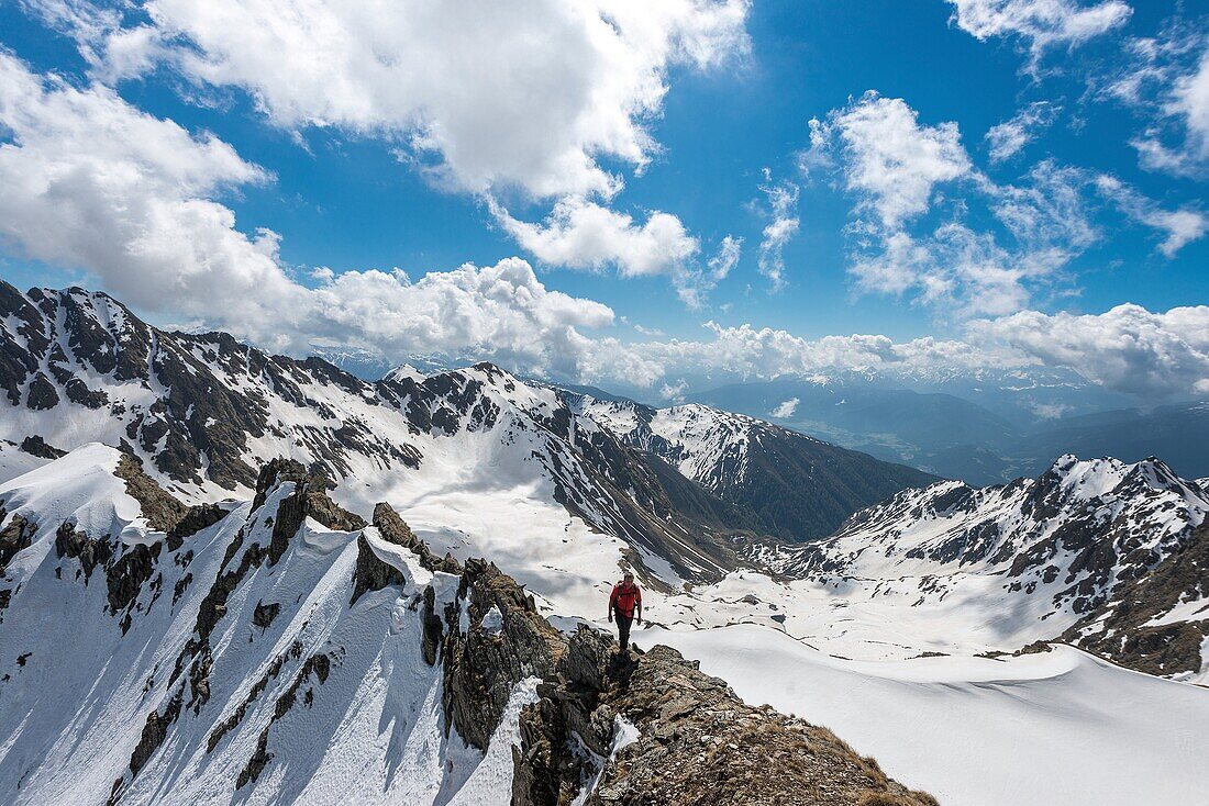 Terento, South Tyrol, Italy Mountaineer along the ridge to Monte Gruppo   Hochgrubbachspitze