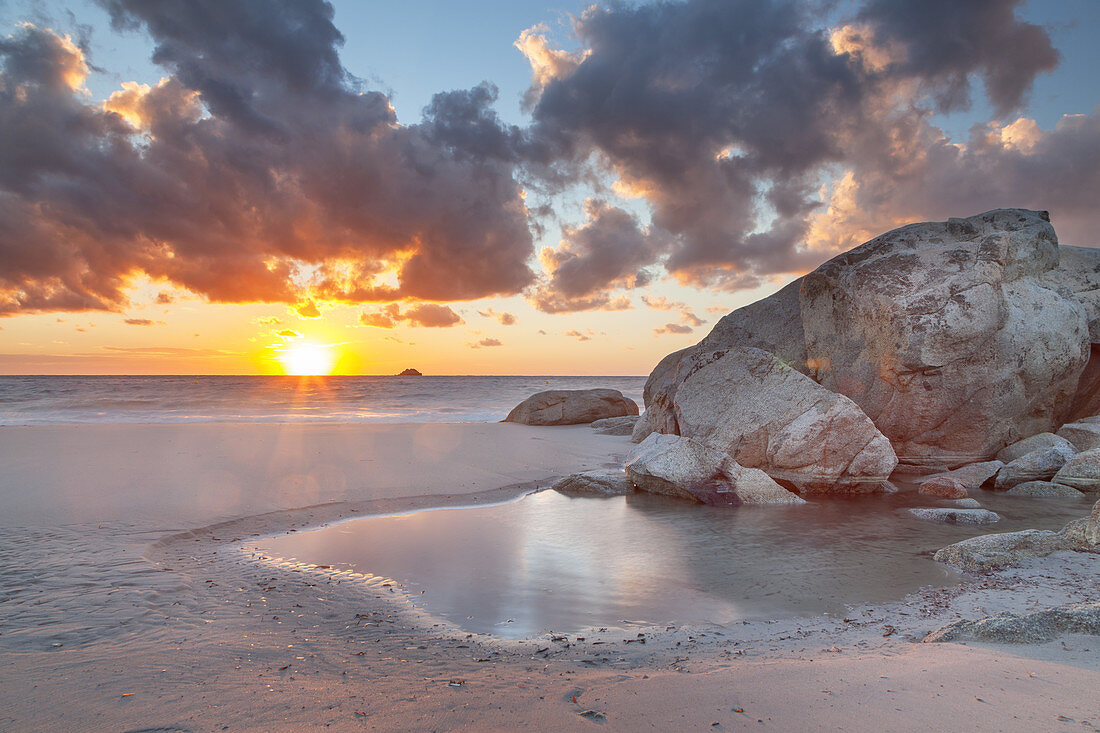 Sunrise over the sea, rocks on the beach of Pinarellu, East Corsica, Corsica, Southern France, France, Southern Europe, Europe