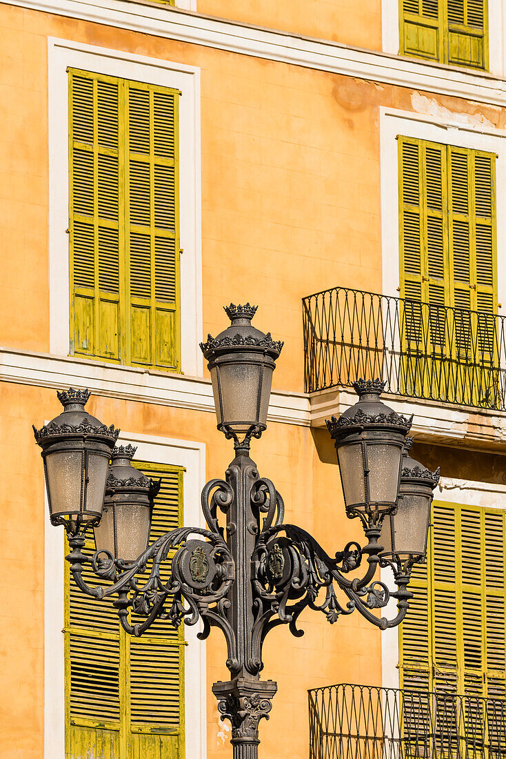 Homes with old street lamp in the public place Placa major in the old town, Palma de Mallorca, Mallorca, Spain