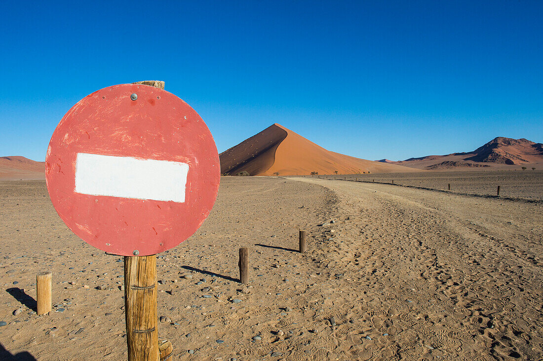No passing sign in front of the giant sand Dune 45, Sossusvlei, Namib-Naukluft National Park, Namibia, Africa