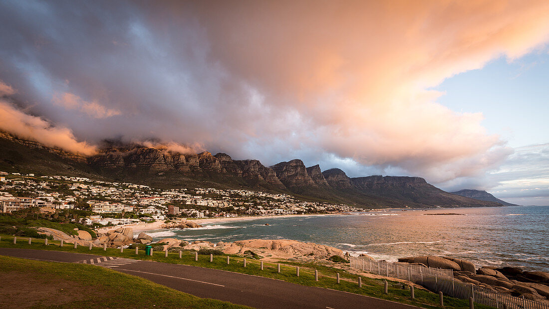Sunset and clouds over Camps Bay, Table Mountain and the Twelve Apostles, Cape Town, South Africa, Africa