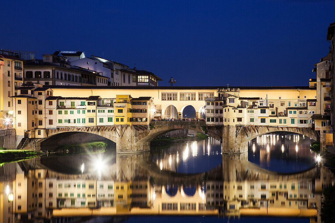 Ponte Vecchio at night reflecting in River Arno, Florence, UNESCO World Heritage Site, Tuscany, Italy, Europe