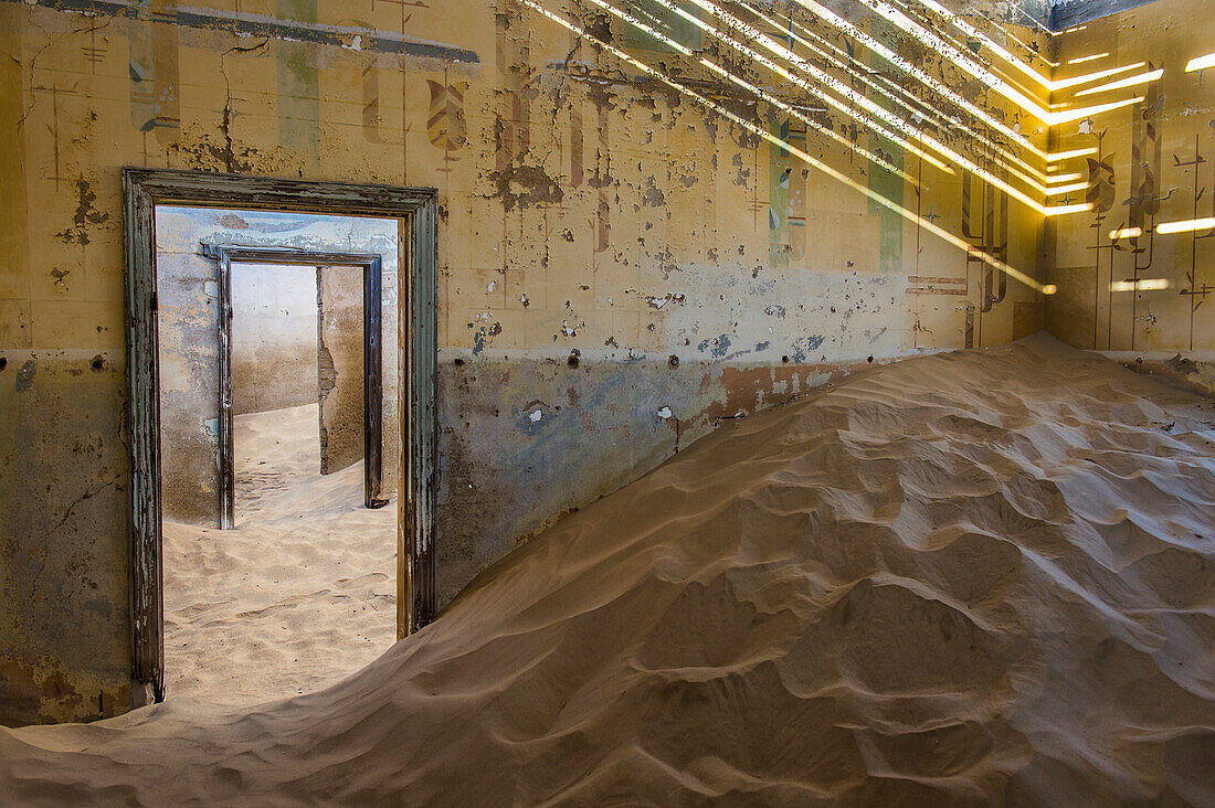 Sand in an old colonial house, old diamond ghost town,  Kolmanskop (Coleman's Hill), near Luderitz, Namibia, Africa