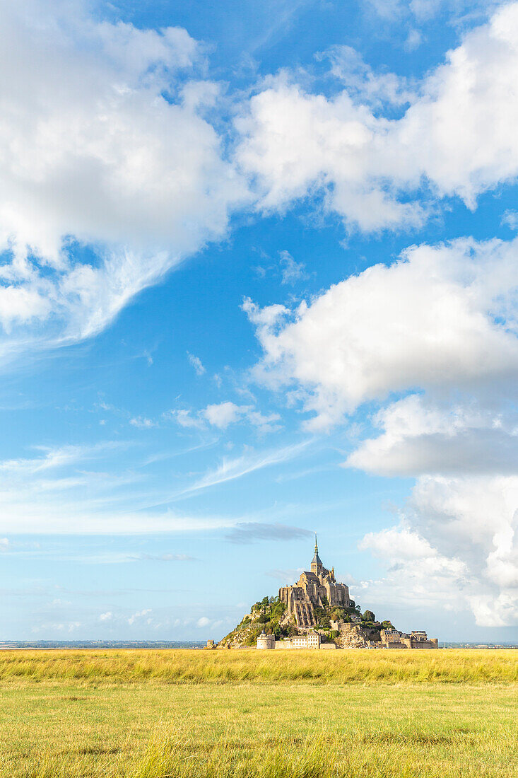 Clouds in the sky and grass in the foreground, Mont-Saint-Michel, UNESCO World Heritage Site, Normandy, France, Europe