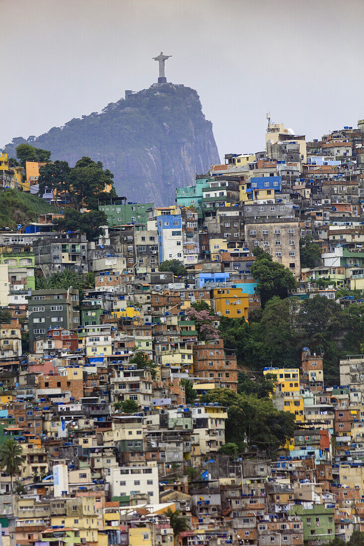 View of Rocinha favela (slum) (shanty town), Corcovado mountain and the statue of Christ the Redeemer, Rio de Janeiro, Brazil, South America