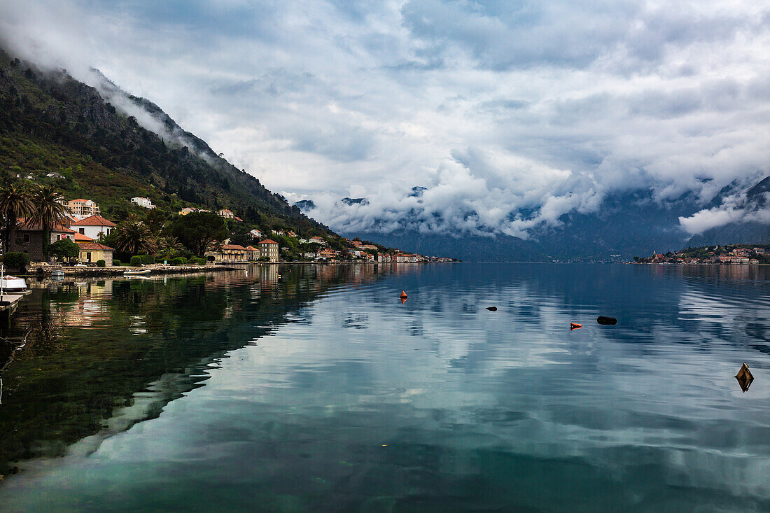 The village of Muo which faces Kotor across the bay, the mountains covered in low cloud, Montenegro, Europe