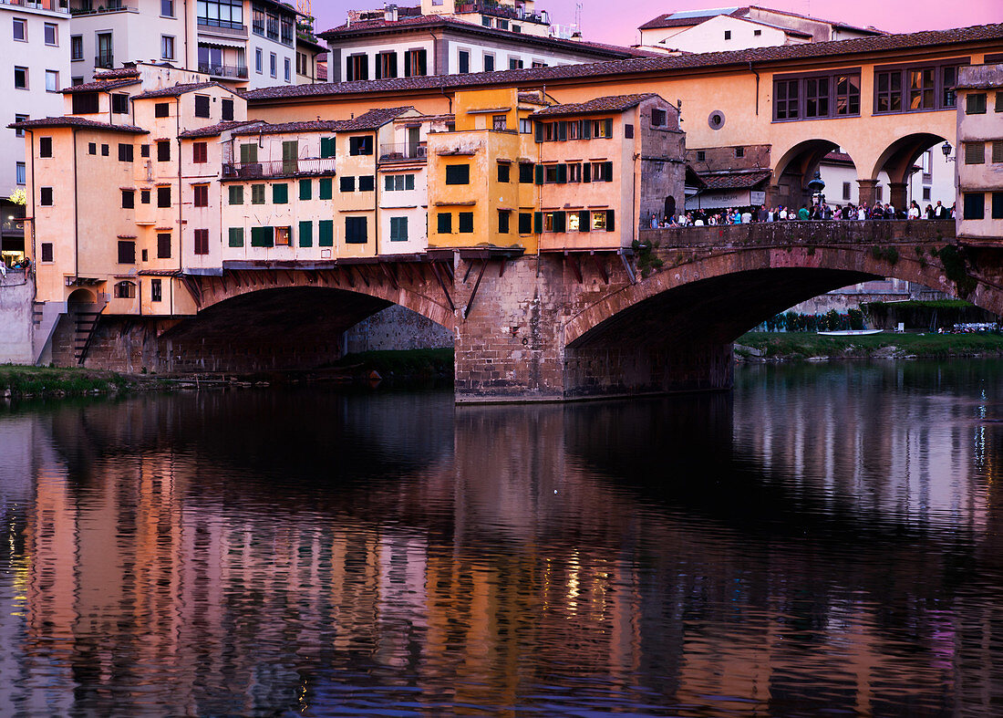 Ponte Vecchio at sunset reflected in the River Arno, Florence, UNESCO World Heritage Site, Tuscany, Italy, Europe