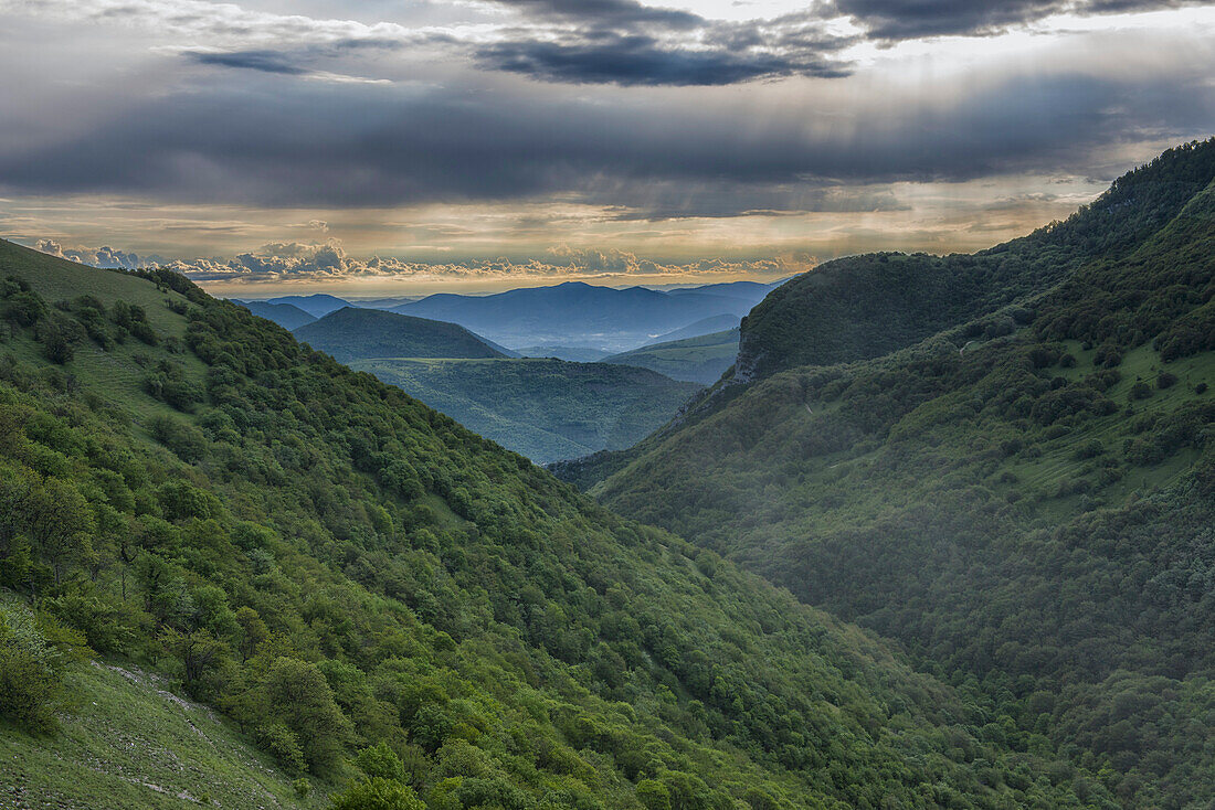 Apennines and Umbrian backcountry at sunrise in a stormy day, Umbria, Italy