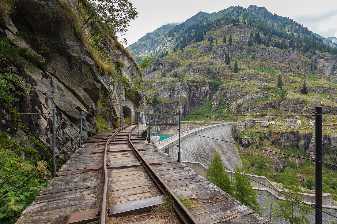 The rails towards the dam of Lago Campliccioli, Valle Antrona, Piedmont, Italy