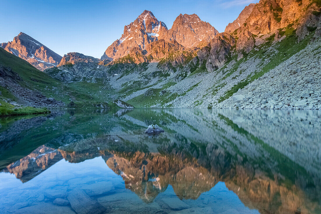 Sunrise on Monviso and Visolotto from the shores of Lago Fiorenza, Crissolo, Po' Valley, Cuneo District, Piedmont, Italy