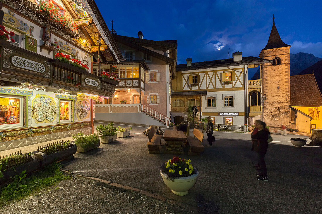 Europe, Italy, Trentino, Val di Fassa, Dolomites, Night view of the historical city center of Canazei illuminated