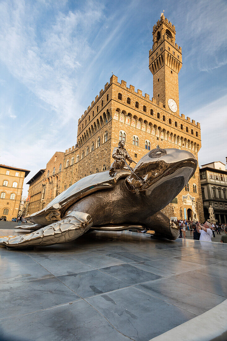 The golden sculpture of a turtle also known as Searching for Utopia in front of Palazzo Vecchio Florence Tuscany Italy Europe