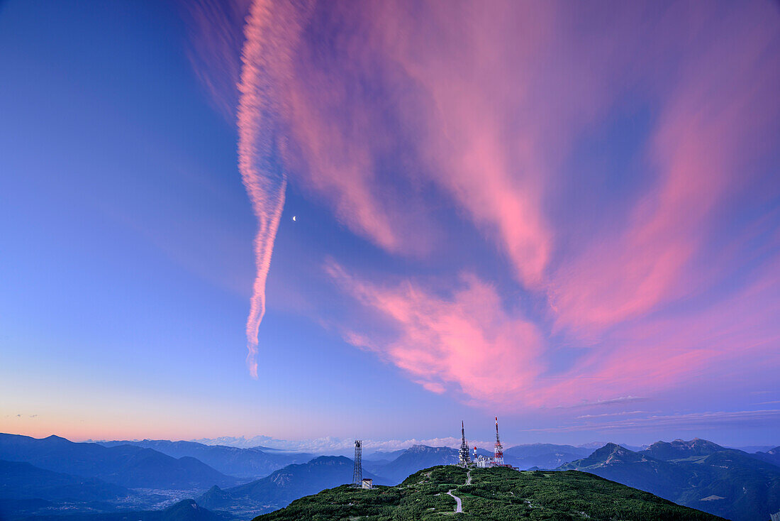 Alpenglow above summit of Paganella, Paganella, Brenta group, UNESCO world heritage site Dolomites, Trentino, Italy